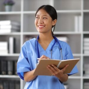 Nurse preparing for NCLEX exam with nursing study materials